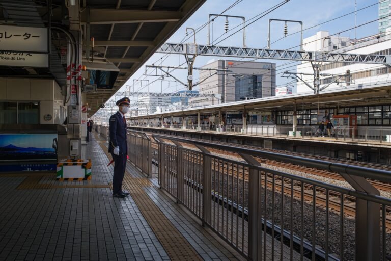 Station staff on Tokaido Line platform in Shizuoka