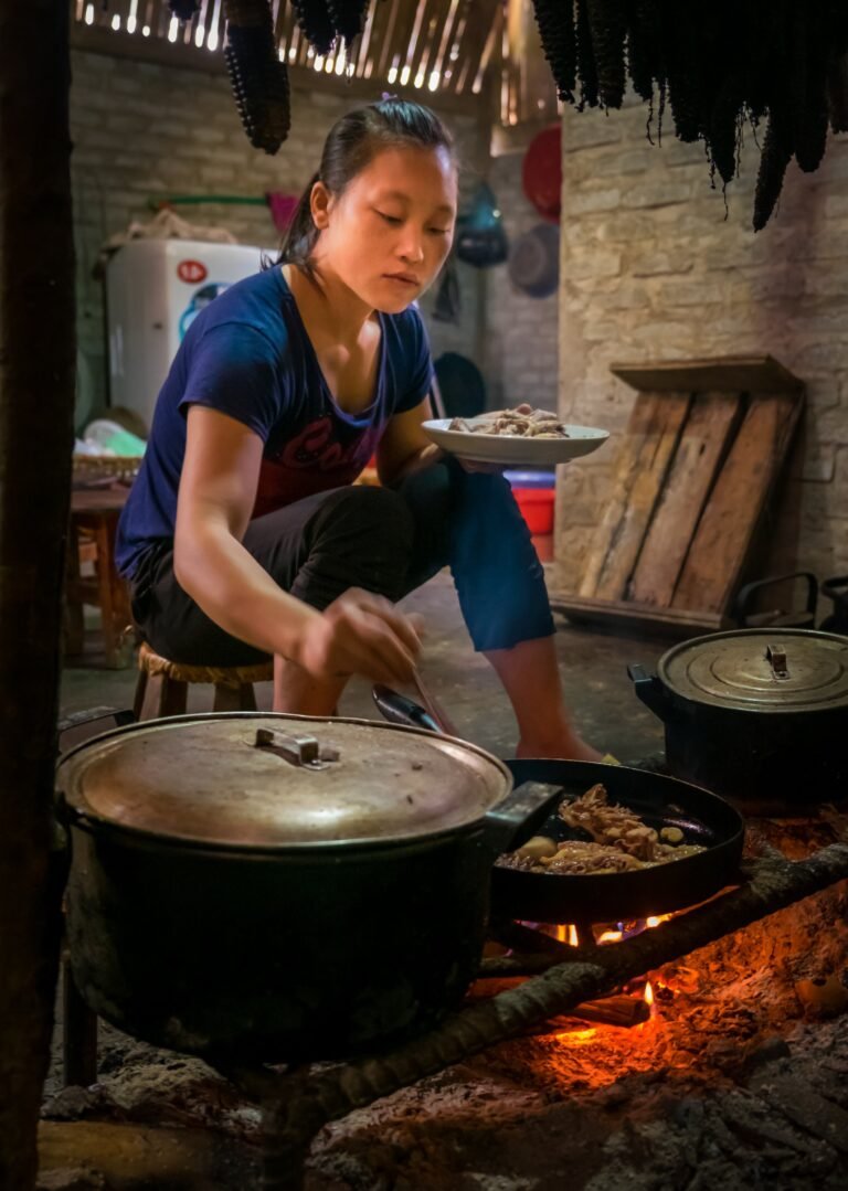 Red Dao woman cooking