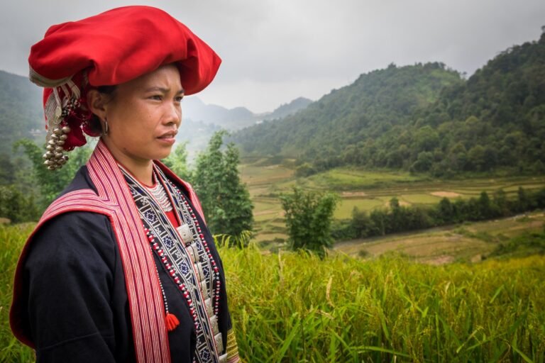 SAPA, VIETNAM - CIRCA SEPTEMBER 2014: Young woman from the Red Dao minority on the rice fields in Ta Phin Village near Sapa, north Vietnam.