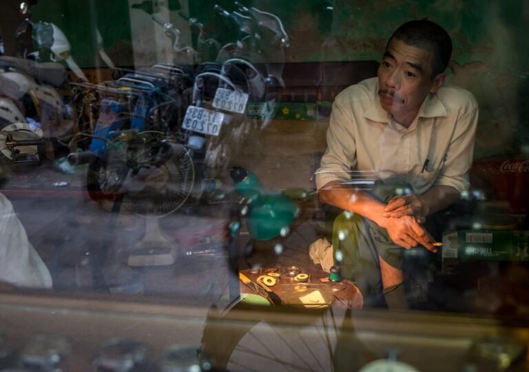 Man Through Window Shop in Hanoi